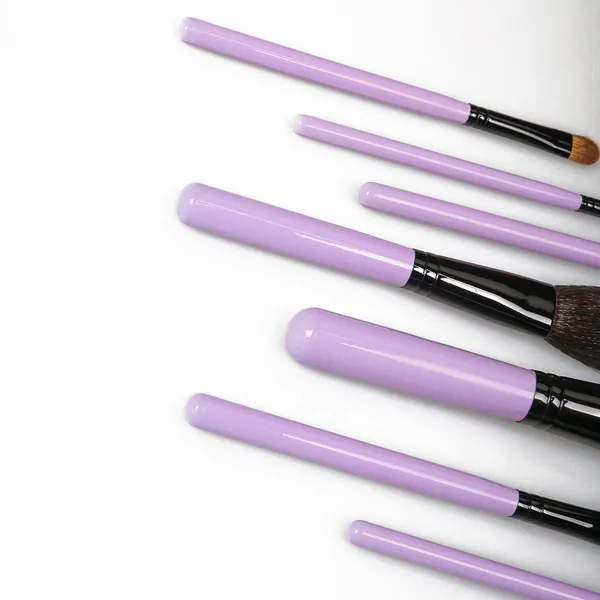 Makeup brush handles showing ergonomic design